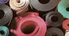 Why it is better for Indian Industries to buy rubber sheets from India than import it from abroad?