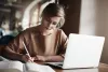 Hardwork woman focused on writing