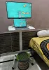 What features should I consider before purchasing an adjustable laptop table?