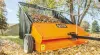 How to utilize a lawn sweeper to clean a road