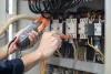 How do electricians in Selly Oak test circuits for power voltage?