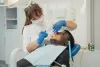 Emergency Dentist Performing Dental Extraction in Katy
