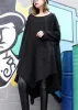 A very elegant black luxury dress with a beautiful hem