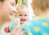 When should my child start using toothpaste and how much should I use?