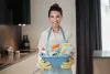 housewife-young-smiling-woman-with-basin-with-cleansing-appliances_1_11zon_2.jpg