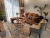 Living Room Decor with Rugs and Poufs