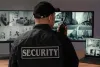 portrait-male-security-guard-with-radio-station-camera-screens_1_11zon.jpg
