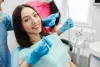 smiling-woman-dentist-chair.jpg