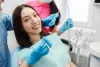 smiling-woman-dentist-chair.jpg