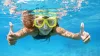 young girl snorkelling underwater
