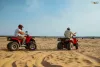 two-men-helmets-riding-atv-desert-sands-back-view-male-persons-quad-bikes-sandy-race-dune-safari-hot-sunny-day-4x4-extreme-adventure-quad-biking-scaled.jpg