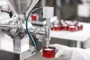 worker-filling-container-with-cream-cosmetic-factory-1024x683.jpg