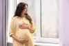 beautiful-pregnant-woman-near-window-home_495423-59786-_1_.jpeg