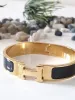 br-104-hermes-clic-h-gold-tone-hinge-bracelet-300x400.jpg