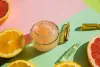 cosmetic-bottle-containers-face-cream-with-orange-slices-natural-beauty-product-concept-ripe.webp