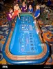 scene-on-gaming-floor-of-casino-excited-woman-throws-dice-at-craps-bkxta3.jpg
