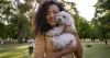 young-lady-cuddling-a-small-white-dog-1200x640.jpg